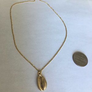 Gold cowrie shel necklace